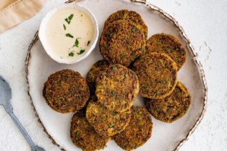 Close-up of golden baked falafel showing crispy edges and herb-filled texture.